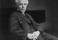 Black and White photo of Bela Bartok in his mid-forties sat in a chair