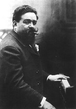 Black and white photograph of Isaac Albeniz at the piano aged 41