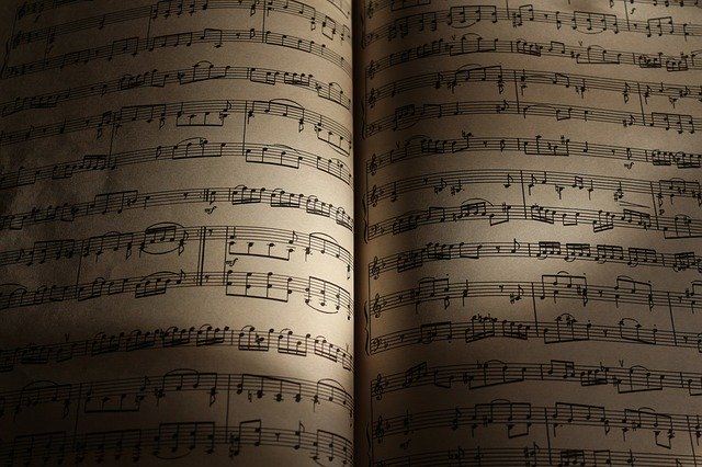 an open book with sheet music