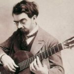 Black & White photograph of Francisco Tarrega playing the guitar
