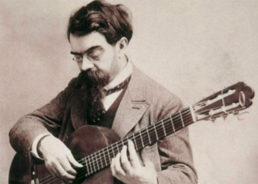 Black & White photograph of Francisco Tarrega playing the guitar