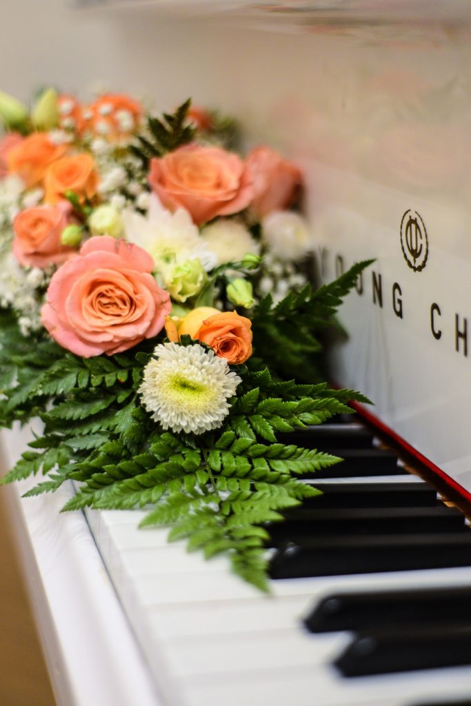 Photo of wedding flowers on a piano